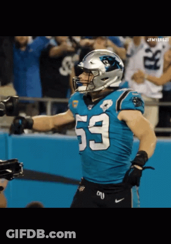 A Football Player With The Number 53 On His Jersey Stands On The Field GIF