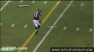 A Football Player With The Number 56 On His Back Is Laying On The Field GIF