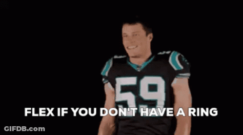 A Football Player With The Number 59 On His Jersey Is Flexing His Arms GIF