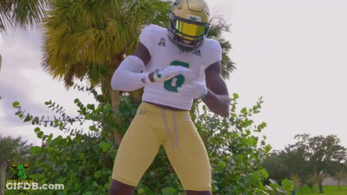 A Football Player With The Number 6 On His Jersey Is Dancing GIF