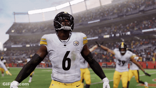 A Football Player With The Number 6 On His Jersey Stands On The Field GIF