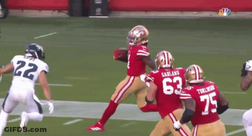 A Football Player With The Number 63 On Their Jersey GIF