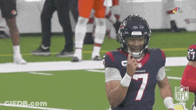 A Football Player With The Number 7 On His Jersey Holds His Finger To His Mouth . GIF