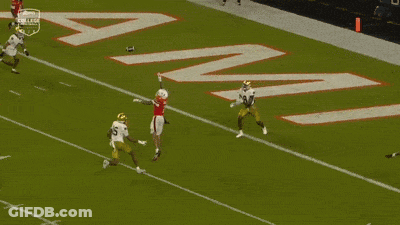 A Football Player With The Number 7 On His Jersey Is Being Tackled By Another Player GIF