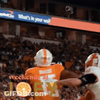 A Football Player With The Number 7 On His Jersey Is Being Tackled GIF
