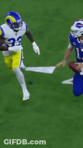 A Football Player With The Number 7 On His Jersey Is Falling GIF
