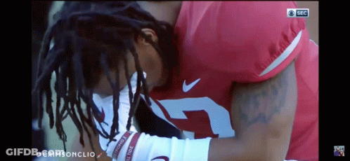 A Football Player With The Number 7 On His Jersey Is Kneeling Down GIF