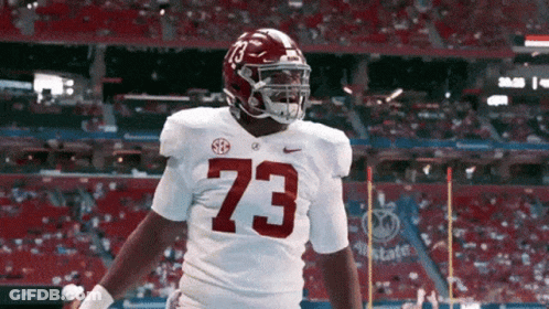 A Football Player With The Number 73 On His Shirt GIF