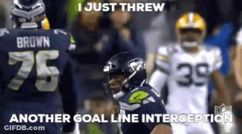 A Football Player With The Number 75 On His Jersey Is Throwing Another Goal Line Interception . GIF