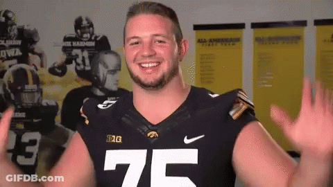 A Football Player With The Number 75 On His Shirt GIF