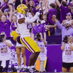 A Football Player With The Number 8 On His Helmet Celebrates GIF