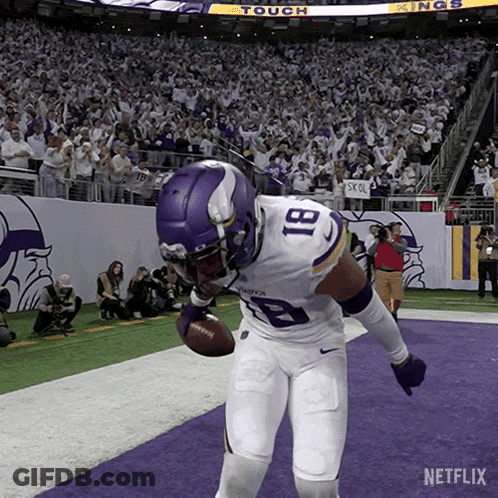 A Football Player With The Number 81 On His Jersey Is Holding A Football GIF
