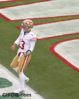 A Football Player With The Number 85 On His Jersey Stands On The Field GIF