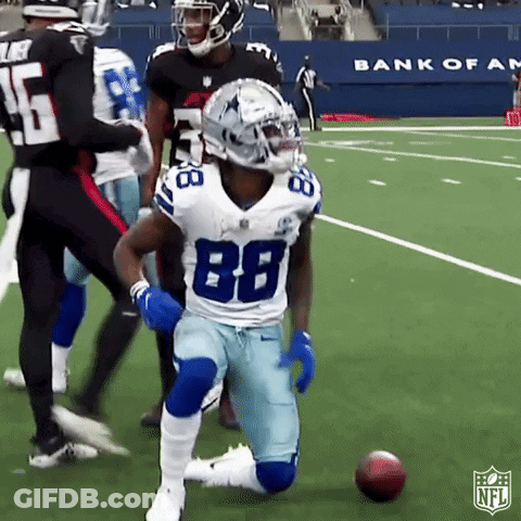 A Football Player With The Number 88 On His Jersey Is Kneeling Down On The Field GIF
