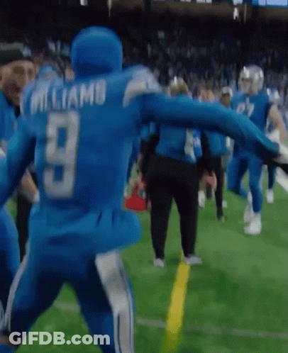 A Football Player With The Number 9 On His Back Is Running On The Field GIF