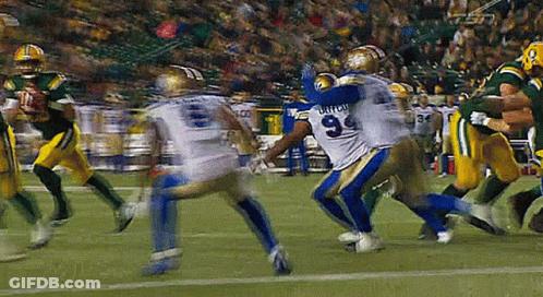 A Football Player With The Number 9 On His Jersey Is Being Tackled By Another Player GIF