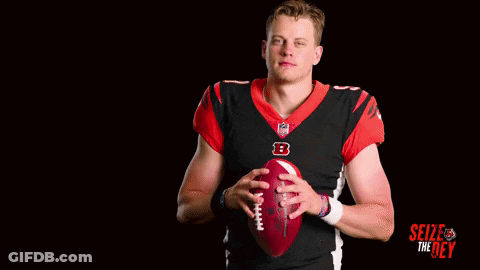 A Football Player With The Number 9 On His Jersey Is Holding A Football GIF