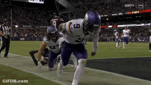 A Football Player With The Number 9 On His Jersey Is Running On The Field GIF