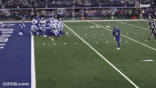 A Football Player With The Number 9 On His Jersey Runs On The Field GIF