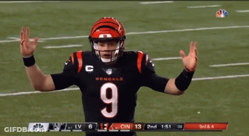 A Football Player With The Number 9 On His Jersey Stands On A Field GIF