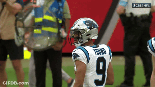 A Football Player With The Number 9 On His Jersey Stands On The Field GIF