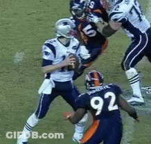 A Football Player With The Number 92 On His Jersey GIF