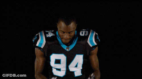 A Football Player With The Number 94 On His Shirt GIF
