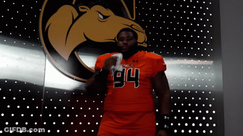 A Football Player With The Number 94 On His Shirt GIF