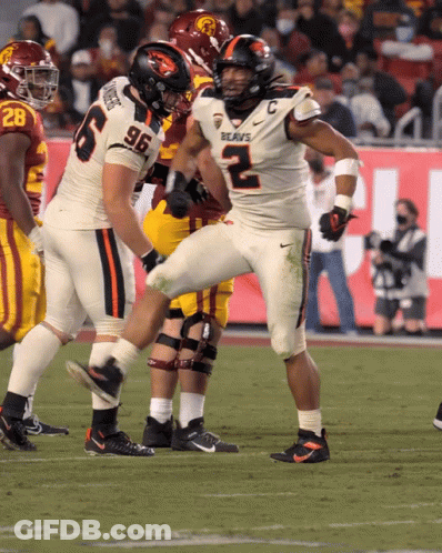 A Football Player With The Number 96 On His Jersey Is Kicking A Ball GIF