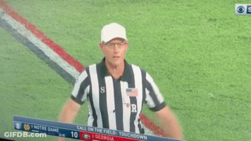 A Football Referee With The Letter R On His Back GIF