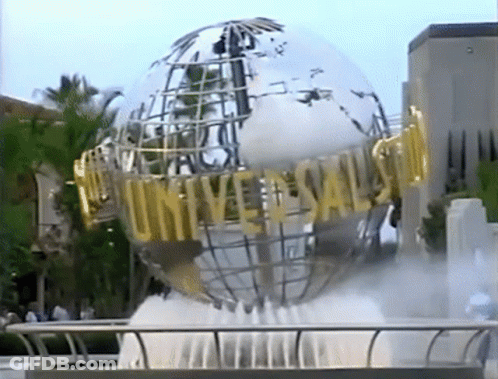 A Fountain In Front Of A Large Globe That Says Universal GIF