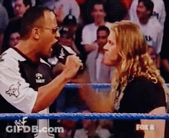 A Fox 8 Broadcast Of A Wrestling Match Between The Rock And A Woman GIF