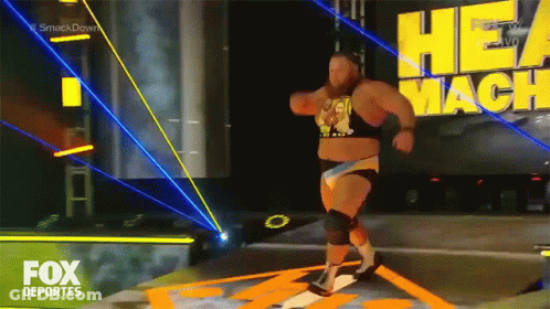 A Fox Deportes Advertisement With A Wrestler Walking On The Stage GIF