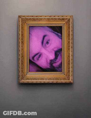 A Framed Picture Of A Man With A Beard GIF