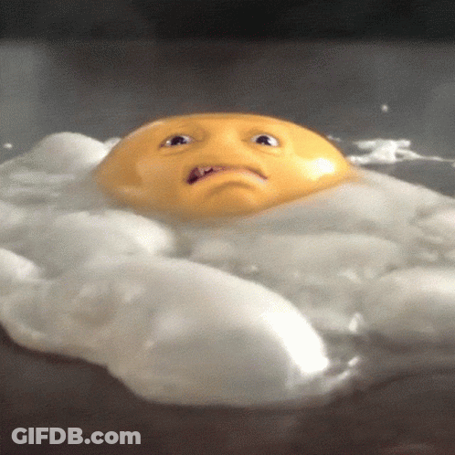 A Fried Egg With A Face On It Is Floating In The Water GIF
