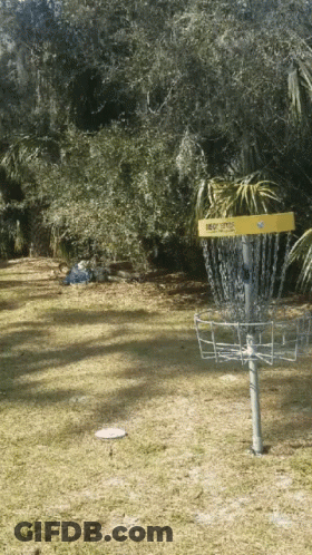 A Frisbee Golf Basket With A Yellow Sticker That Says ' Eagle ' On It GIF
