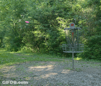 A Frisbee Is Being Thrown Into A Basket That Has The Letter B On It GIF