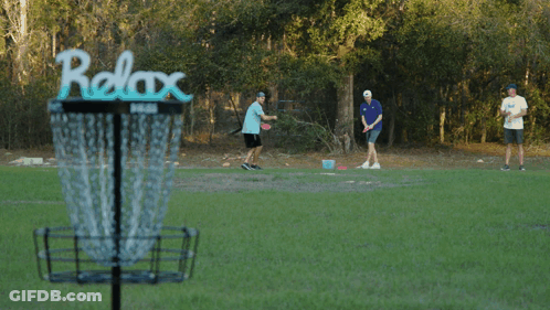 A Frisbee Is Being Thrown Into A Basket That Says Prize On It GIF