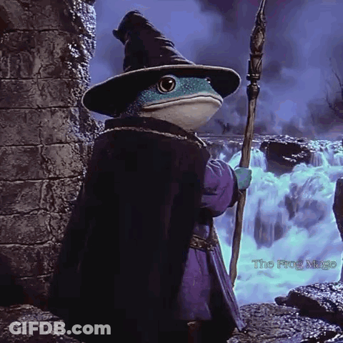 A Frog Dressed As A Wizard Is Holding A Wand GIF