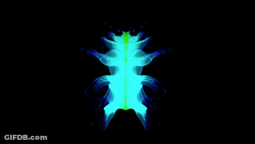 A Frog 'S Skeleton Is Glowing Blue And Green In The Dark GIF