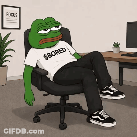 A Frog Wearing A Shirt That Says Bored Is Sitting In An Office Chair GIF