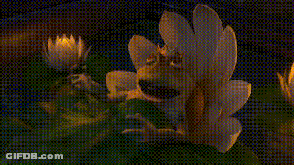 A Frog With A Crown On Its Head Is Sitting On A Lily Pad In A Pond . GIF