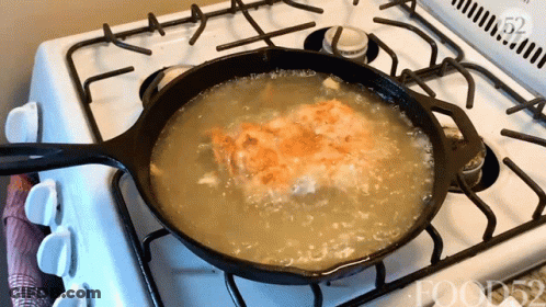 A Frying Pan Is On A Stove With Food52 Written On The Bottom GIF
