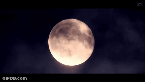 A Full Moon In A Dark Sky With A S On The Bottom Left GIF