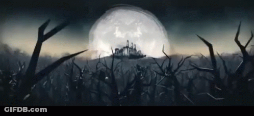 A Full Moon Is Behind A Castle In The Distance GIF
