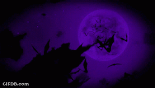 A Full Moon Is Behind A Tree With Bats Flying Around It GIF