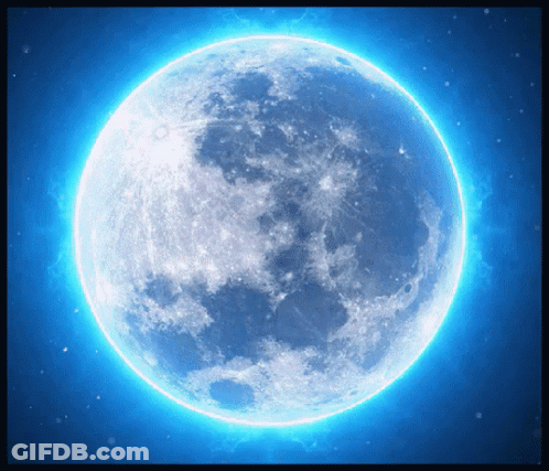 A Full Moon Is Glowing Brightly In A Blue Sky GIF