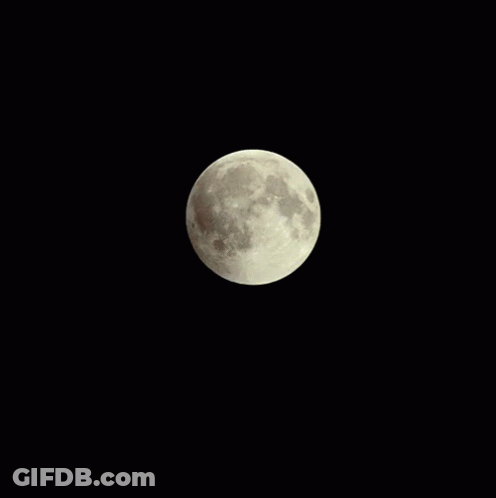 A Full Moon Is Visible In The Dark Night Sky GIF