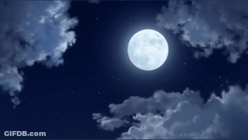 A Full Moon Shines Brightly In The Night Sky GIF