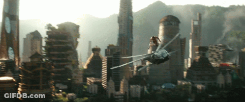 A Futuristic City With A Helicopter Flying Overhead GIF